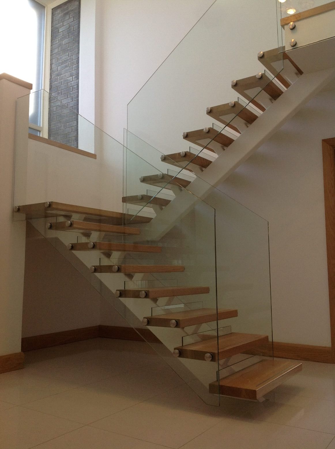 White steel spine stairs Manufactured and fitted in Blackrock Co